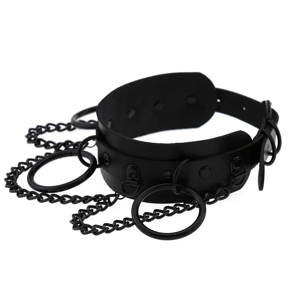 Black Brat collar viewed from the side, showing durable vegan leather structure and side rings for leash attachment.