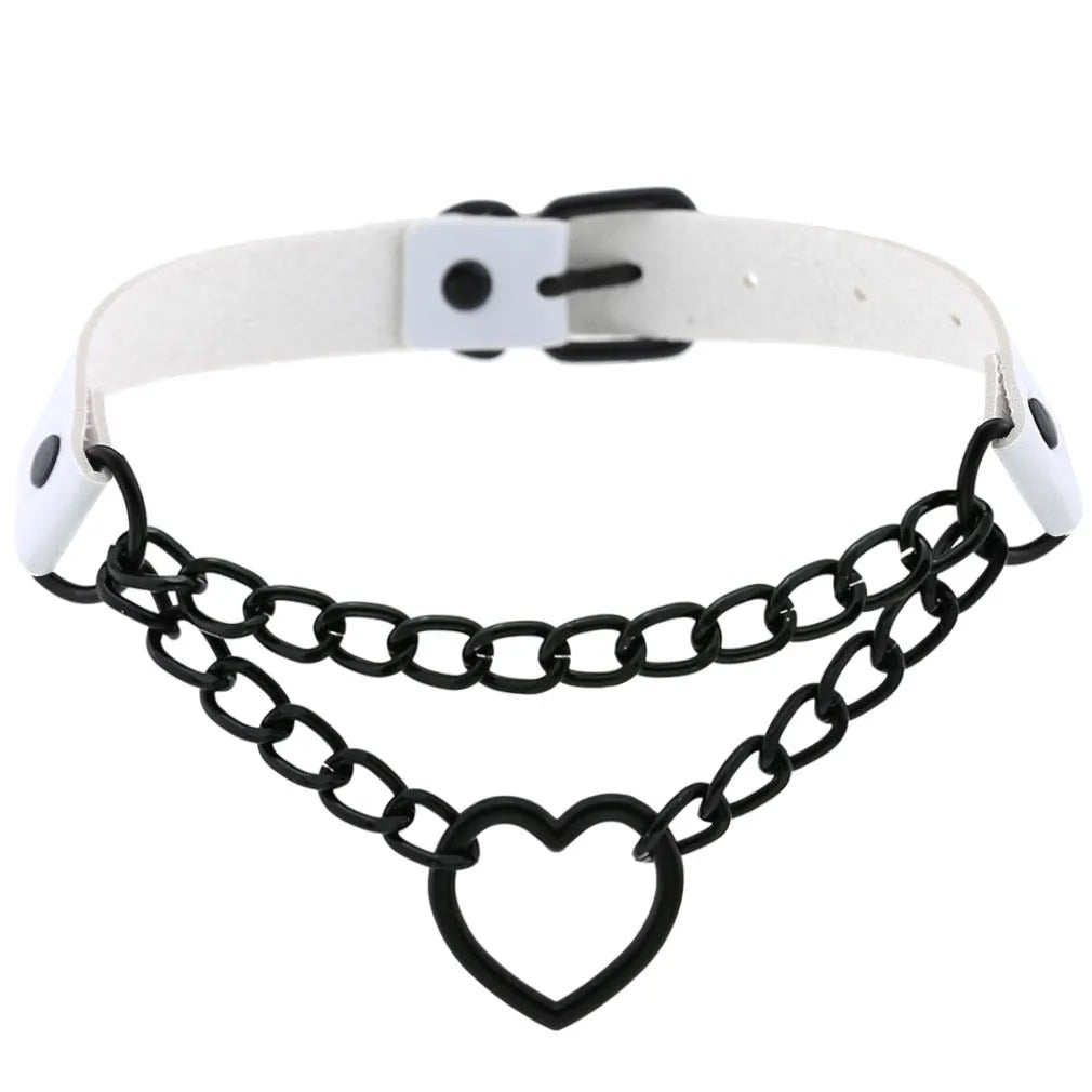 he white vegan leather Chain Heart Choker variation styled with edgy high-contrast black metal hardware and layered chains.