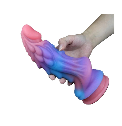 and holding the colorful pastel fantasy dragon toy, showcasing its size and realistic grip for solo or couples play.