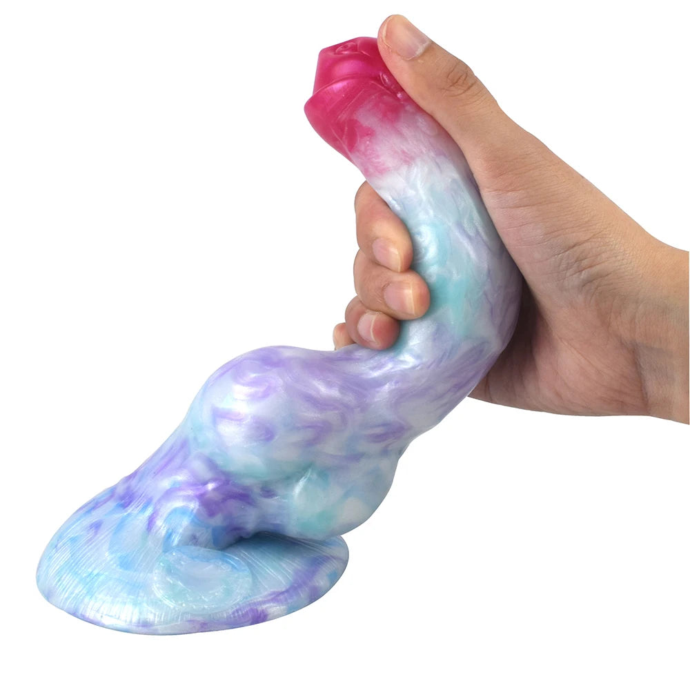 Hand holding the blue and purple pastel galaxy fantasy dildo to show its realistic size, texture, and grip.