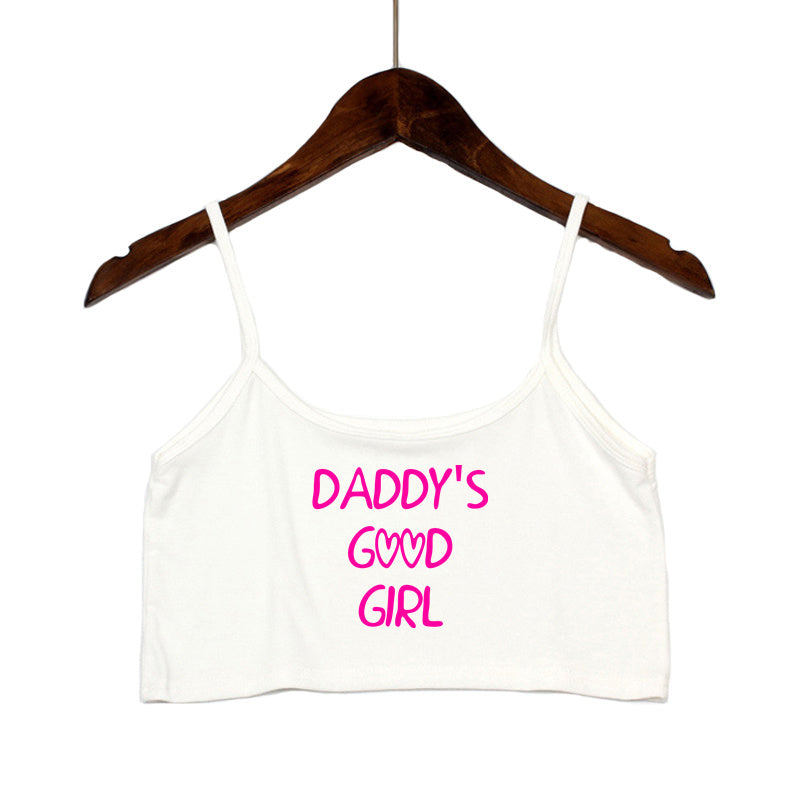 White spaghetti strap top with 'Daddy's Good Girl' pink text. Sweet and kinky alternative crop top