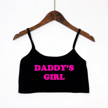 Black crop top with neon pink 'Daddy's Girl' text. Cute DDLG and pet play fashion top