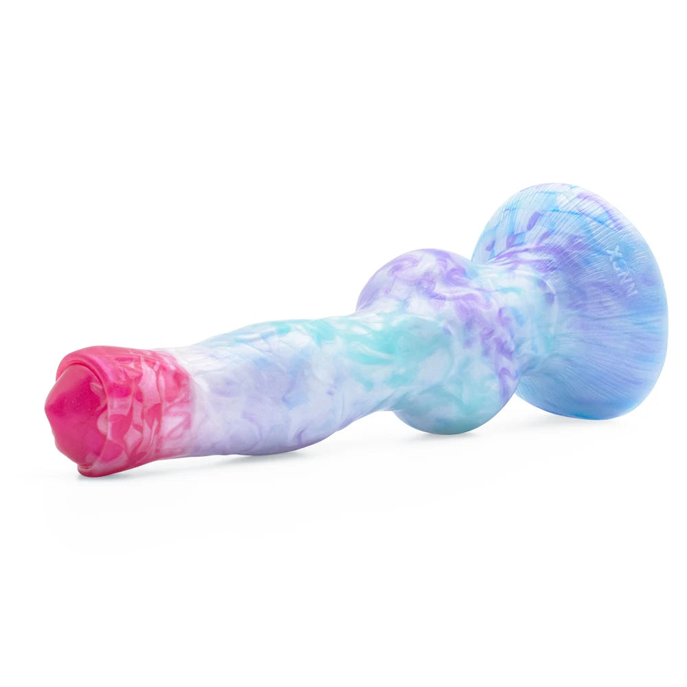 Pastel galaxy swirl blue and purple marbled fantasy knot toy resting horizontally.