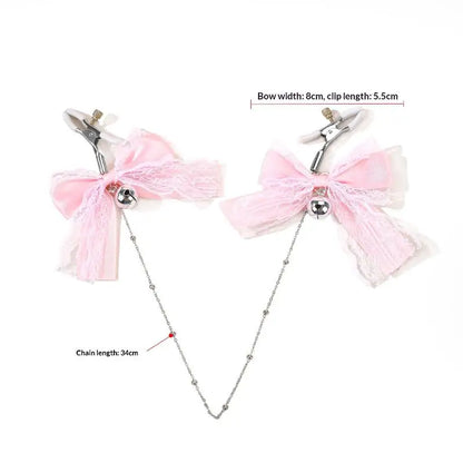 Dimensions of the kawaii pink ribbon nipple clamps showing the width of the bows, clip size, and total chain length.