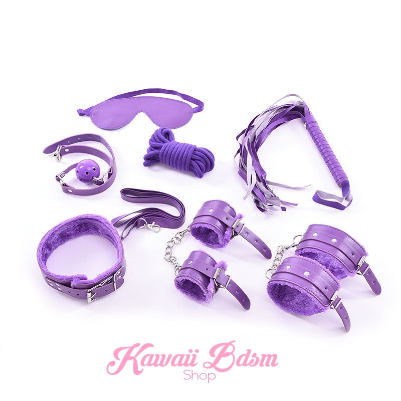 Layout of the royal purple 7-piece bondage kit highlighting the fluffy faux fur cuffs and collar.