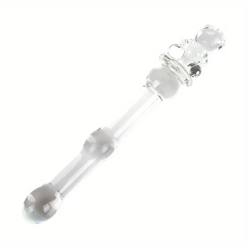 Diagonal view of a petite clear glass pleasure wand with a teddy bear handle on a plain white background.