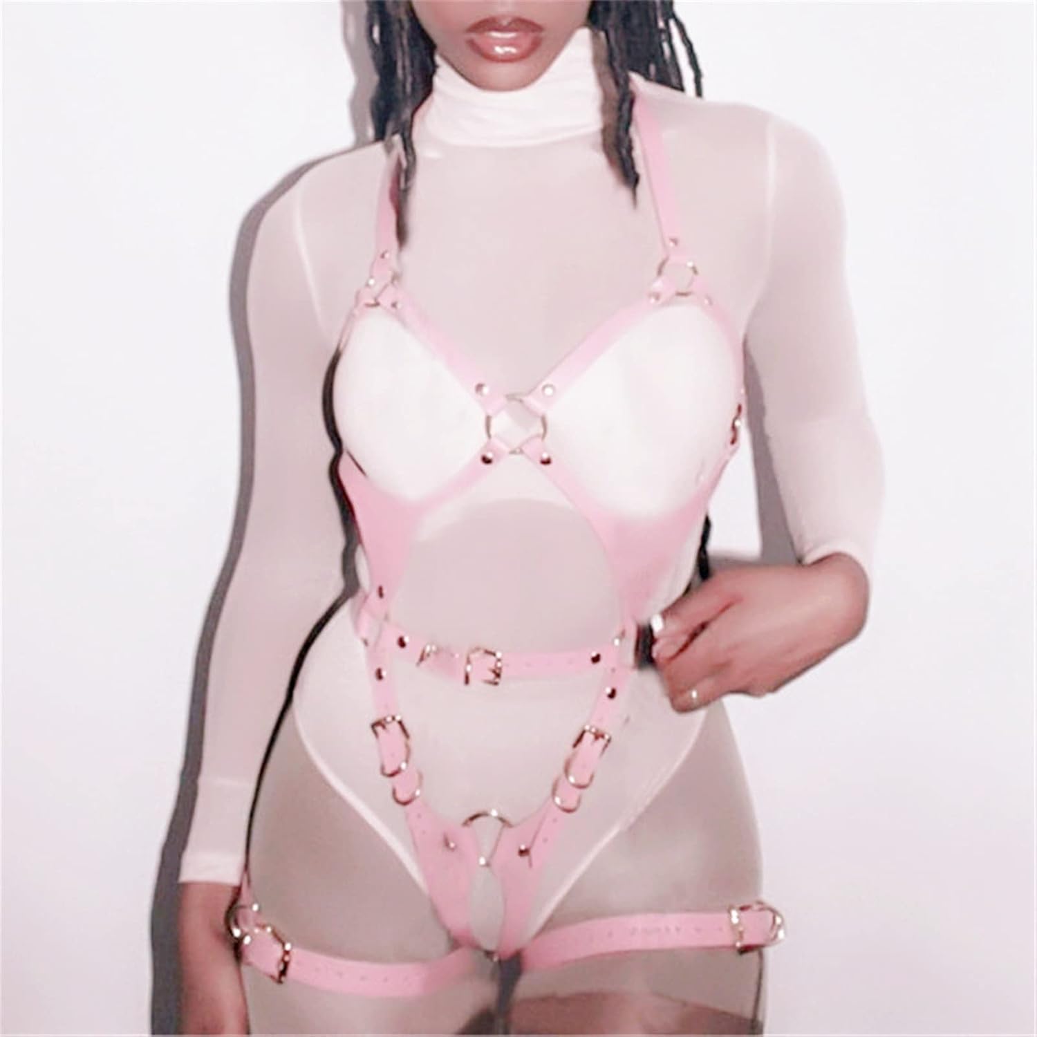 Pastel pink full-body faux leather strappy harness featuring silver O-rings and adjustable buckles. Kawaii BDSM aesthetic fashion.