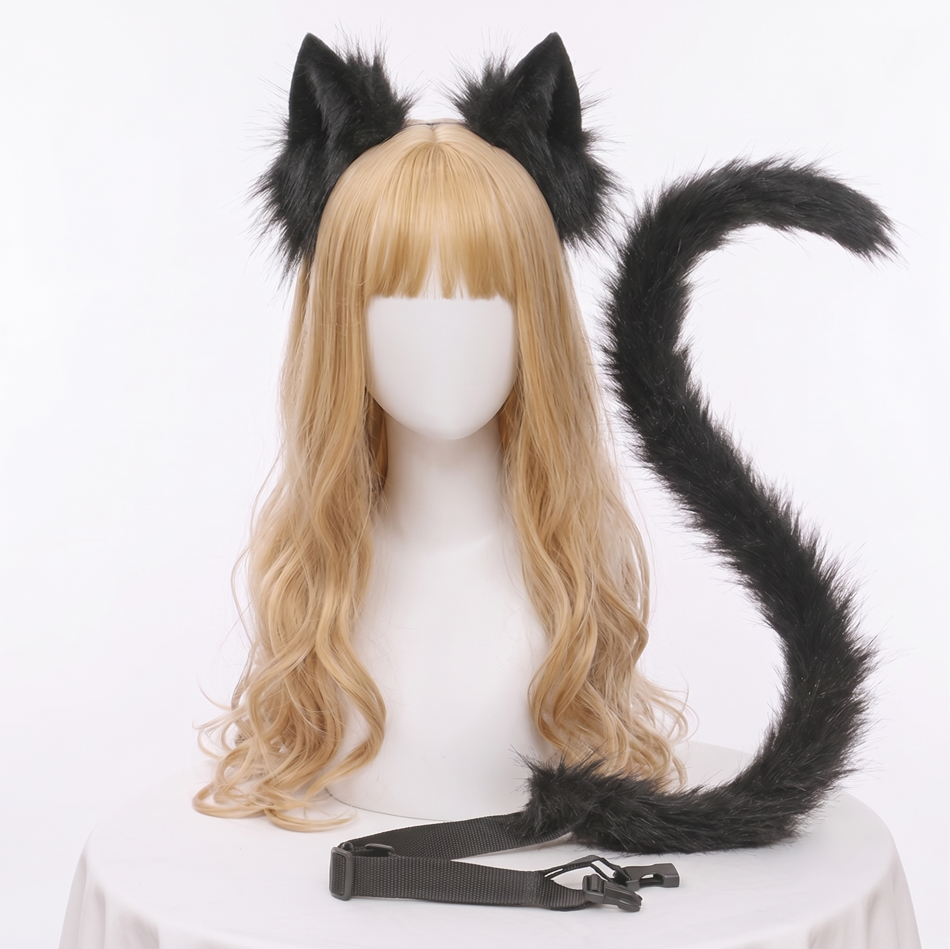 A black posable faux fur animal tail and matching ears set displayed on a mannequin head with a blonde wig. The long tail is curled into an S-shape and clearly features a black adjustable waist strap for SFW cosplay.