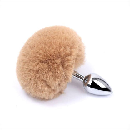 A natural light brown fluffy bunny tail pom-pom plug, offering a very realistic wild rabbit aesthetic.