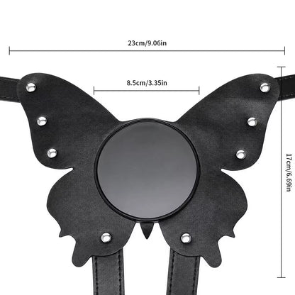 A dimension diagram of the black vegan leather butterfly harness, showing a width of 23 cm, a height of 17 cm, and highlighting the center suction base.
