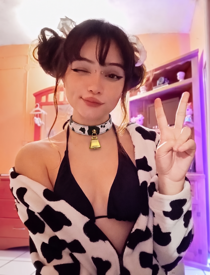 model wearing Cow print choker with golden hardware and bell, cos cosplay and accessories