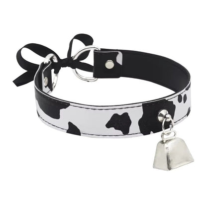 Kawaii-style black and white cow patterned leather collar for pet play.