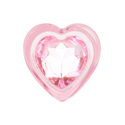 Cute Kawaii BDSM pink glass plug with a sparkling heart aesthetic Close-up of the faceted jewel-like pink heart base on the premium glass plug that acts as a safe stopper.