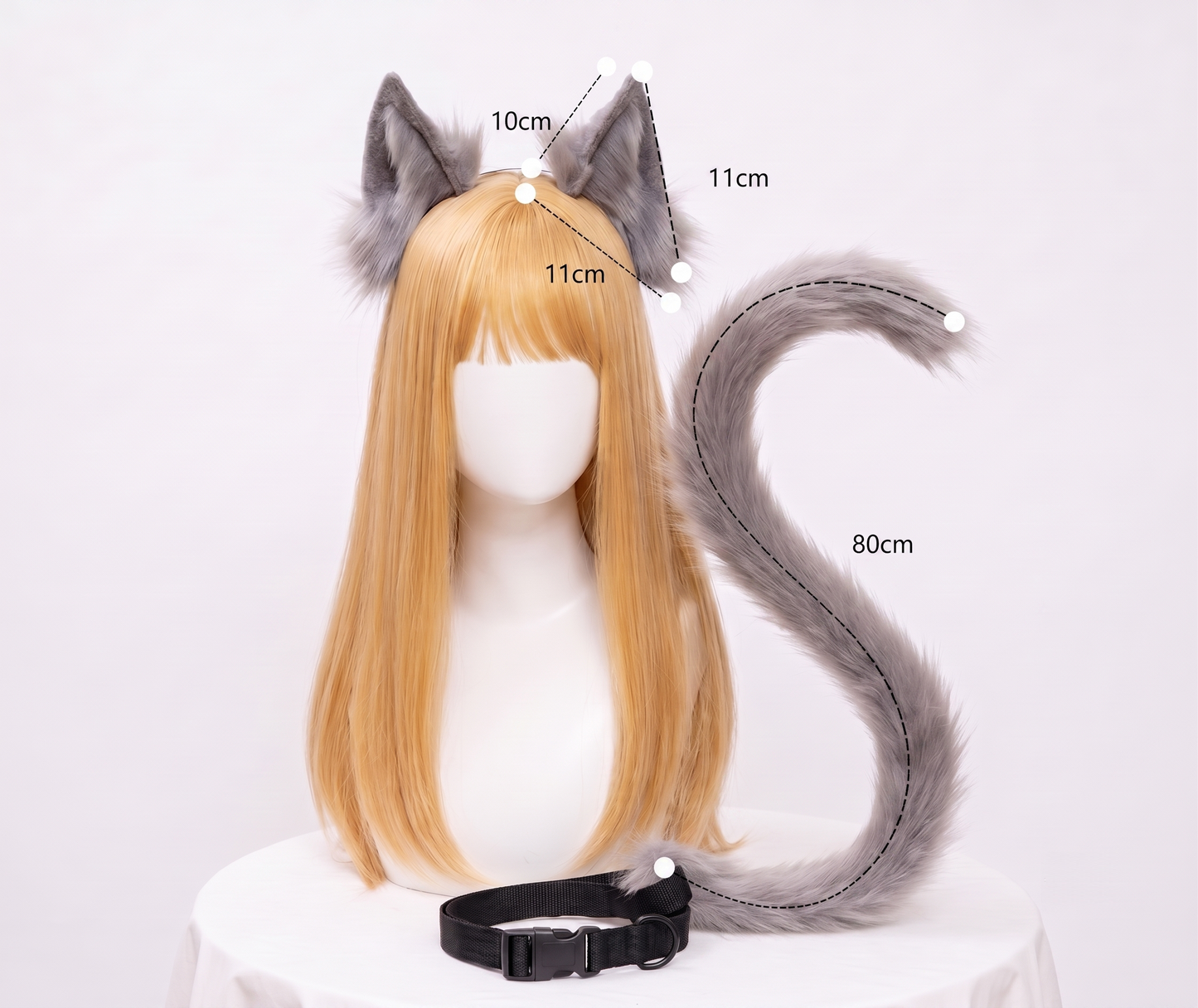 A side-angle view of the grey faux fur SFW cosplay tail and ears set on a mannequin, showcasing the impressive length and bendable nature of the tail accessory.