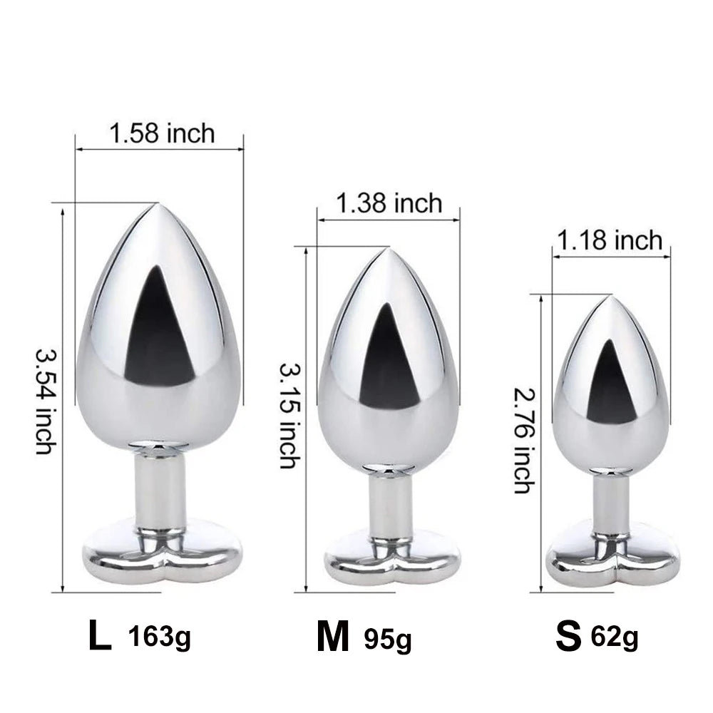 Detailed size chart for the crystal heart stainless steel plugs showing visual dimensions and weights for Small, Medium, and Large sizes.