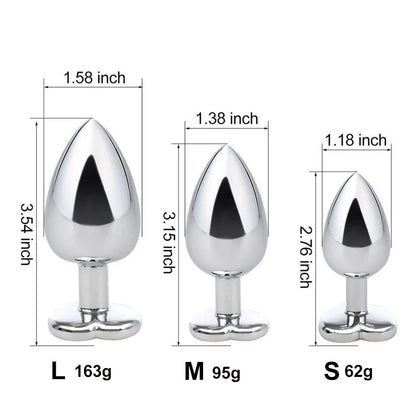 Detailed size chart for the crystal heart stainless steel plugs showing visual dimensions and weights for Small, Medium, and Large sizes.