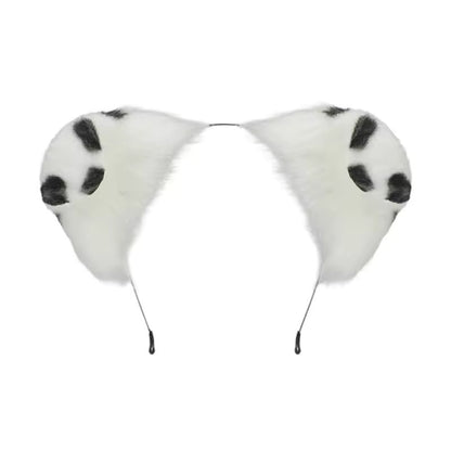Detailed isolation shot of a thin metal headband featuring two highly textured, fully poseable fluffy faux fur puppy ears with a crisp white base and contrasting black dalmatian spots.