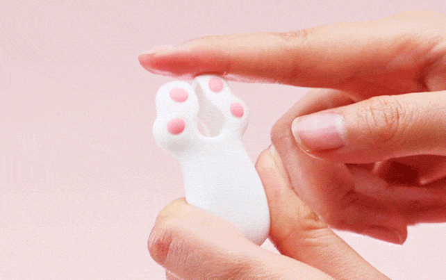Close-up of the Kitten Paw vibrator showing the internal granular texture for nipple and clitoral stimulation.
