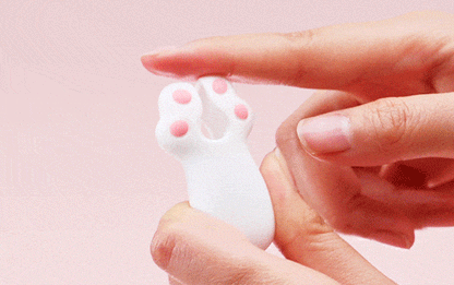 Close-up of the Kitten Paw vibrator showing the internal granular texture for nipple and clitoral stimulation.
