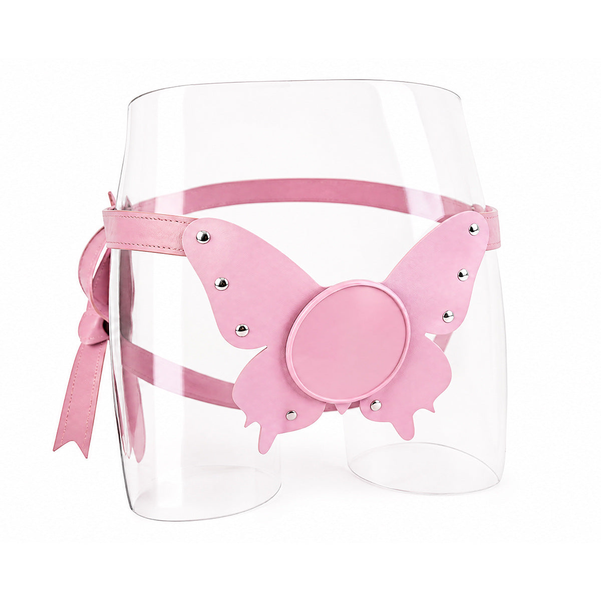 A stunning pastel pink vegan leather butterfly harness featuring a flat suction cup base and silver studs, elegantly displayed on a clear mannequin torso.