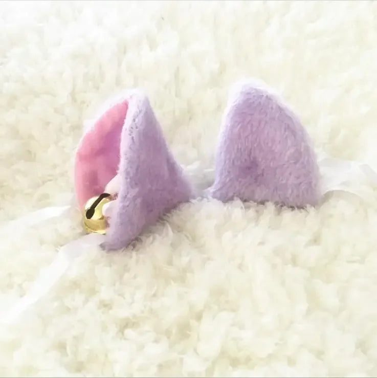 Pastel purple fluffy kitten play ear clips with ribbons and bells.