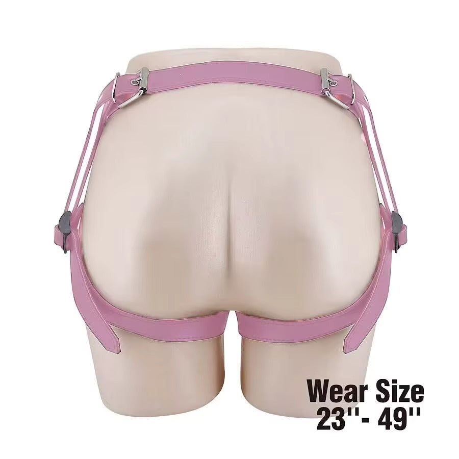 The back view of a pastel pink vegan leather butterfly harness on a mannequin, highlighting the adjustable thigh and waist straps that accommodate wear sizes from 23 inches to 49 inches.