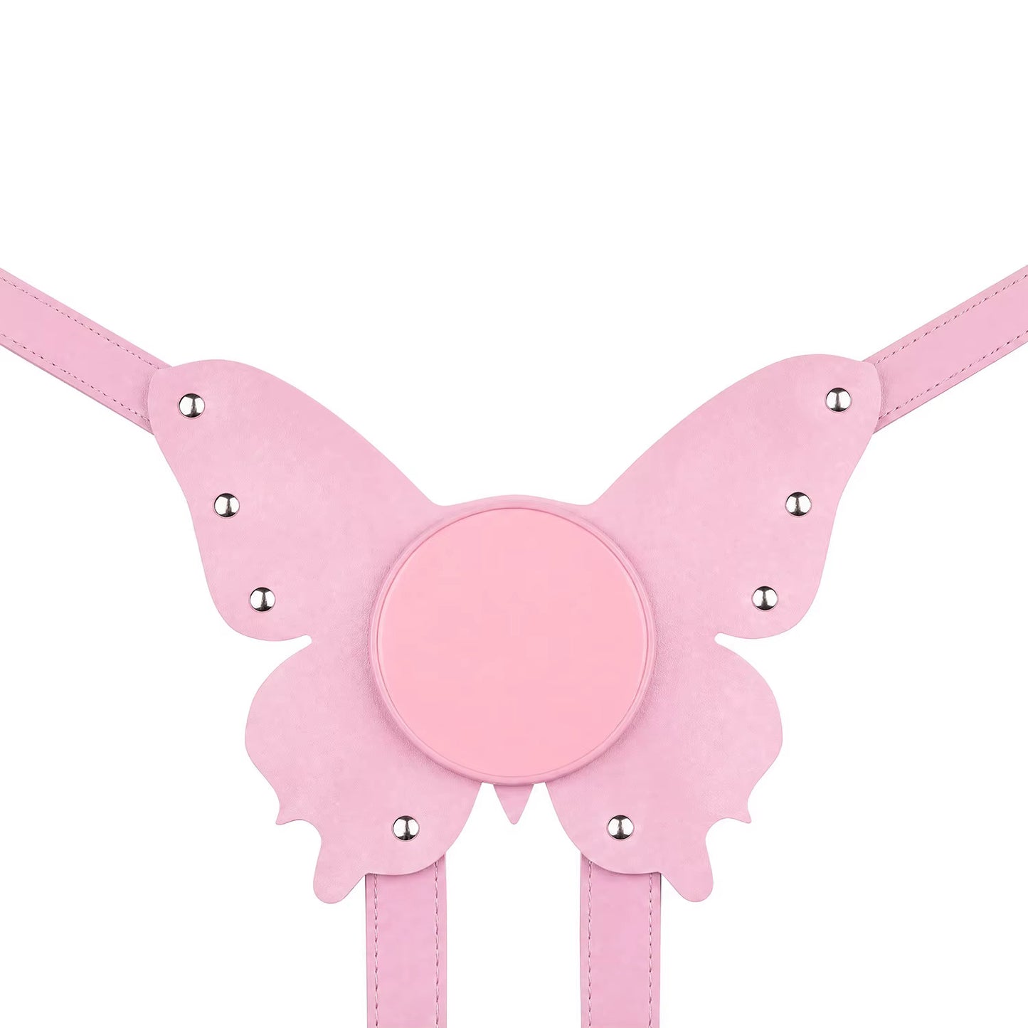 A flat lay of the pastel pink butterfly strap-on harness plate, perfectly displaying its unique structured shape, vegan leather texture, and smooth suction cup base.