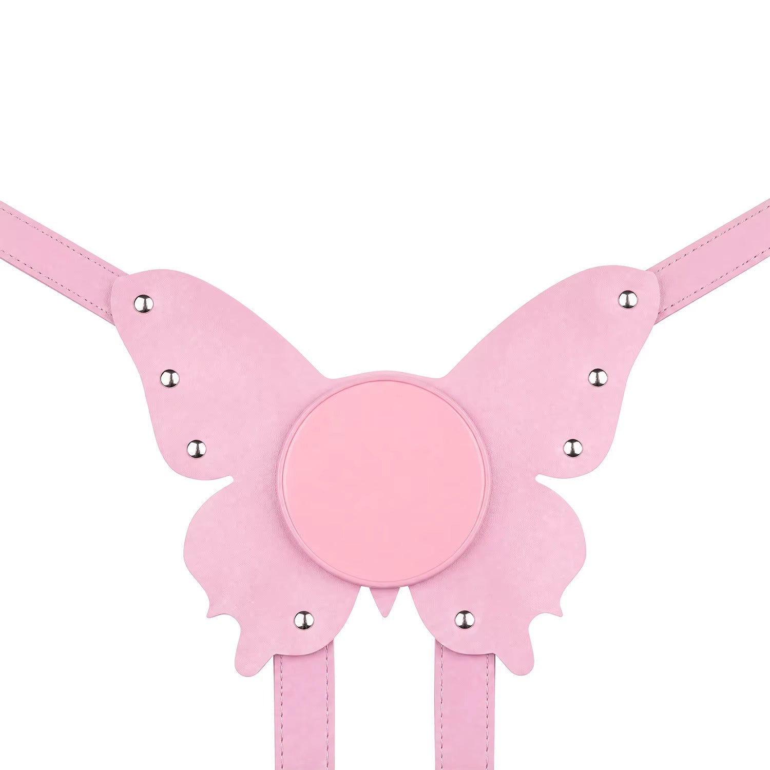 A flat lay of the pastel pink butterfly strap-on harness plate, perfectly displaying its unique structured shape, vegan leather texture, and smooth suction cup base.