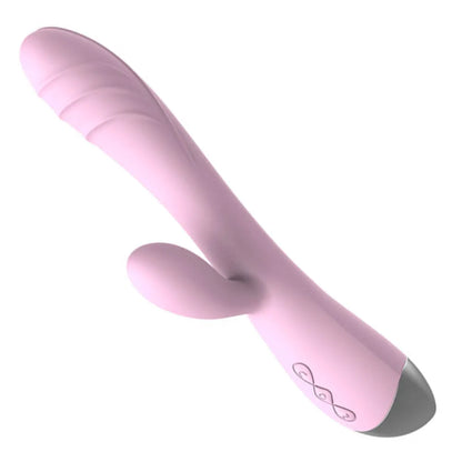 Angled view of the baby pink Pastel Dream Rabbit Vibrator, showing the sleek curved shaft and flexible clitoral stimulator.