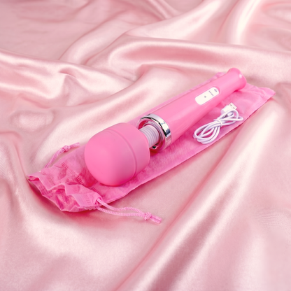 The pink 10-speed wand vibrator resting on its matching pink discreet travel and storage pouch on a luxurious satin background.