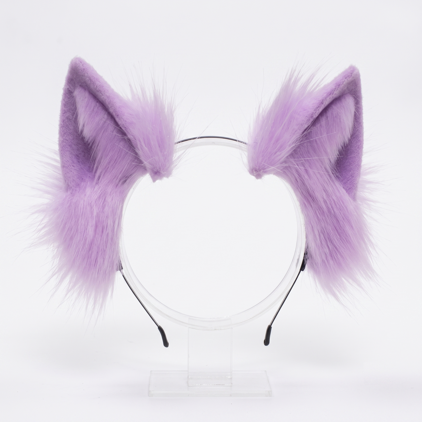 A pair of fluffy purple faux fur cosplay ears attached to a thin, flexible metal headband, isolated on a clean white background.