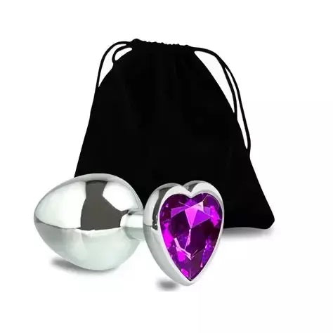 A beautiful purple crystal heart stainless steel plug displayed gracefully next to its discreet black velvet storage pouch.