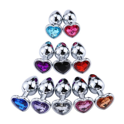 A creative pyramid stack of crystal heart stainless steel plugs showcasing the wide variety of gorgeous jewel colors.