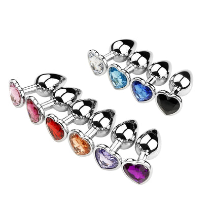 Neatly arranged rows of crystal heart stainless steel plugs displaying a beautiful and colorful aesthetic gradient.