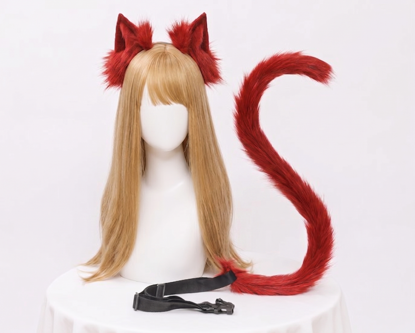 A bright red SFW faux fur fox ear and tail set featuring a flexible long tail with a black waist buckle strap.