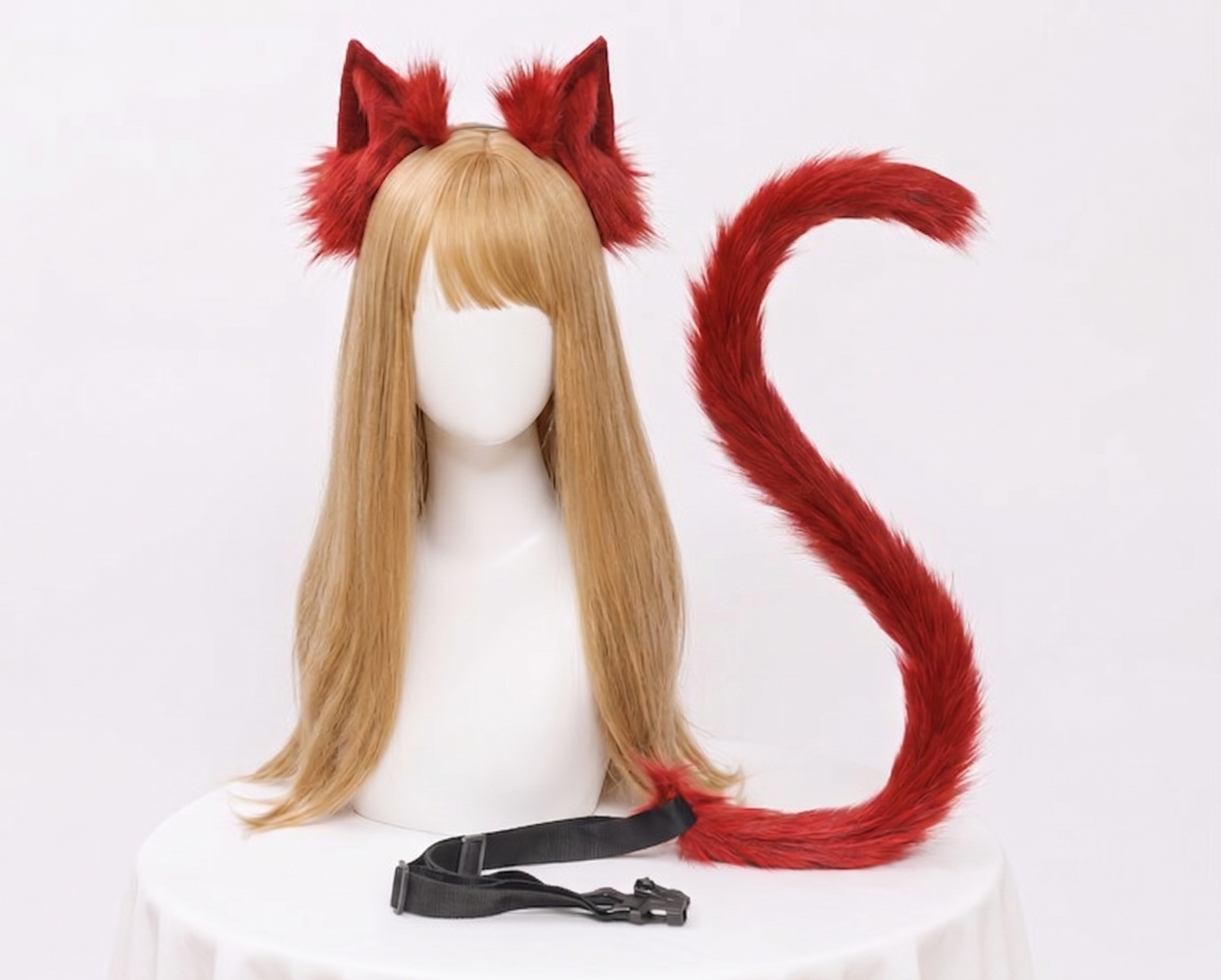 A bright red SFW faux fur fox ear and tail set featuring a flexible long tail with a black waist buckle strap.