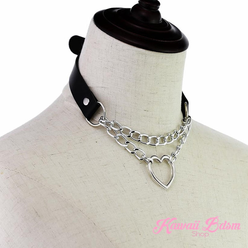 classic black leather and silver chain heart choker collar displayed on a white boutique jewelry mannequin.
