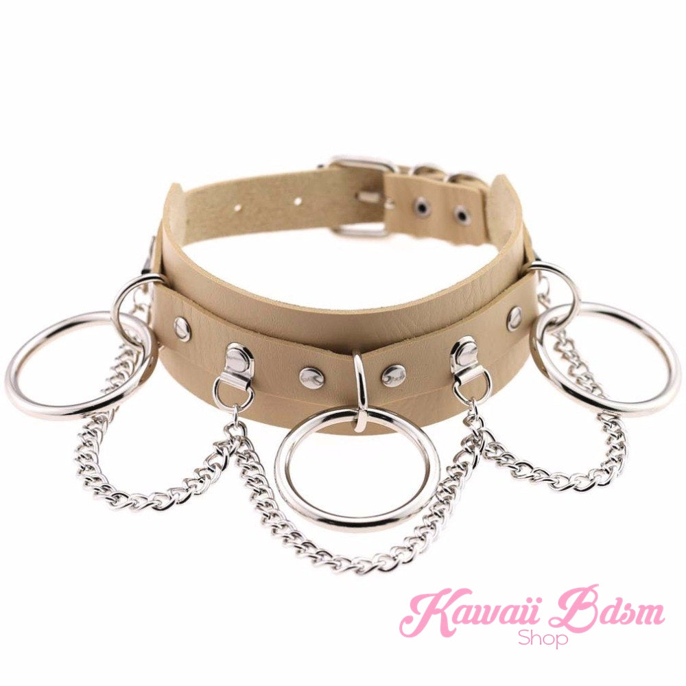 Beige/nude vegan leather Brat collar with silver chains, soft-kawaii aesthetic.