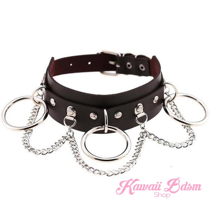 Classic brown vegan leather Brat collar with silver-toned metal chains and O-Ring, punk-kawaii aesthetic.