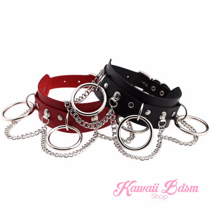 Brat collar combining red and black vegan leather with silver chains, bold and naughty design.