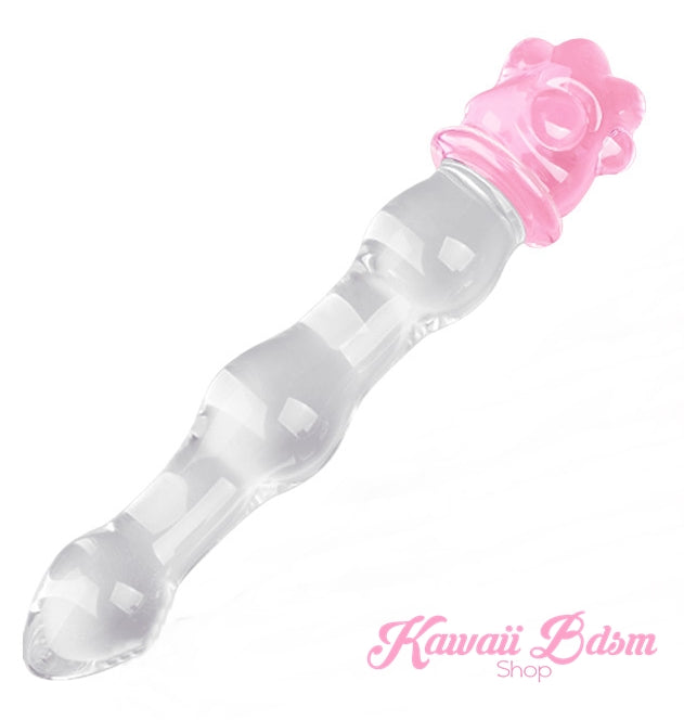 Diagonal view of the clear glass wand with a pink paw base, a perfect addition to any kawaii kink toy collection.