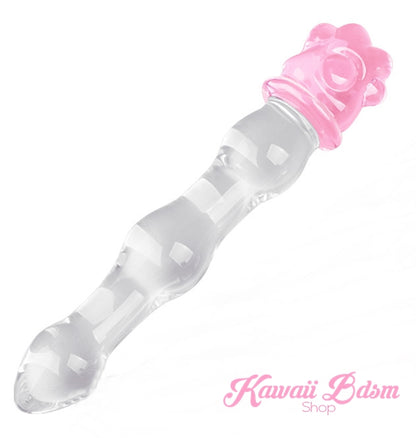 Diagonal view of the clear glass wand with a pink paw base, a perfect addition to any kawaii kink toy collection.