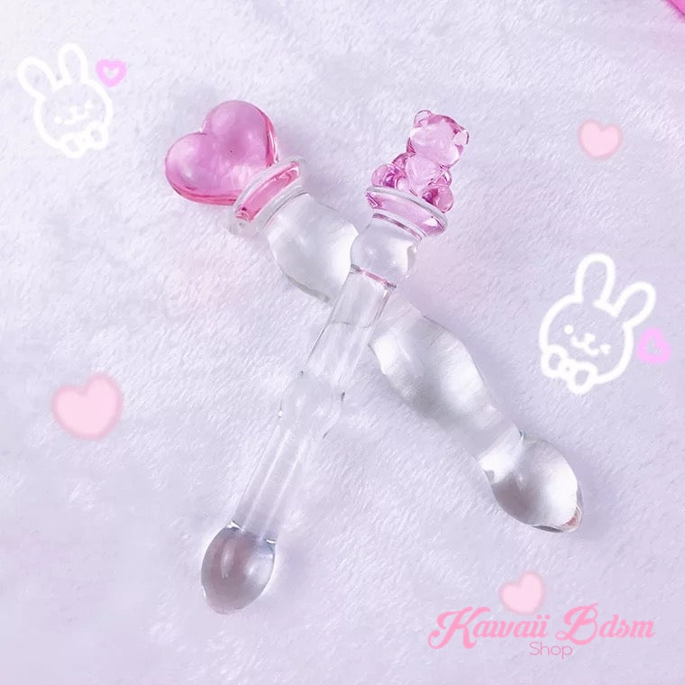The slim pink teddy bear glass wand displayed diagonally on a dreamy pastel purple background with kawaii bunny doodles.