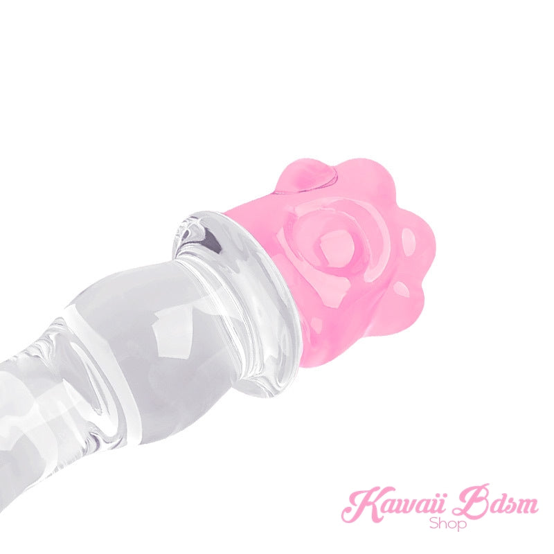 Angled view of the glass paw wand showing the textured shaft curves and the cute pink paw grip.
