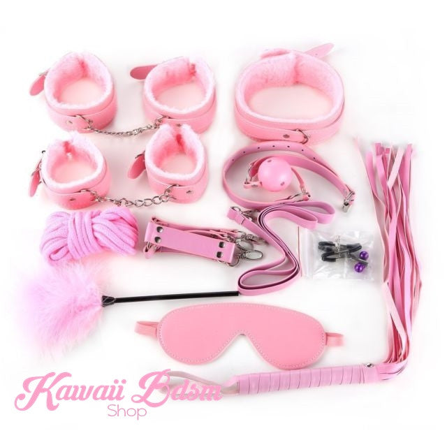 Neatly arranged pastel pink 10-piece plush bondage kit showing all included restraints.