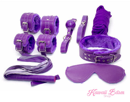 Royal purple complete 7-piece bondage starter set with soft plush lining on a plain white background.