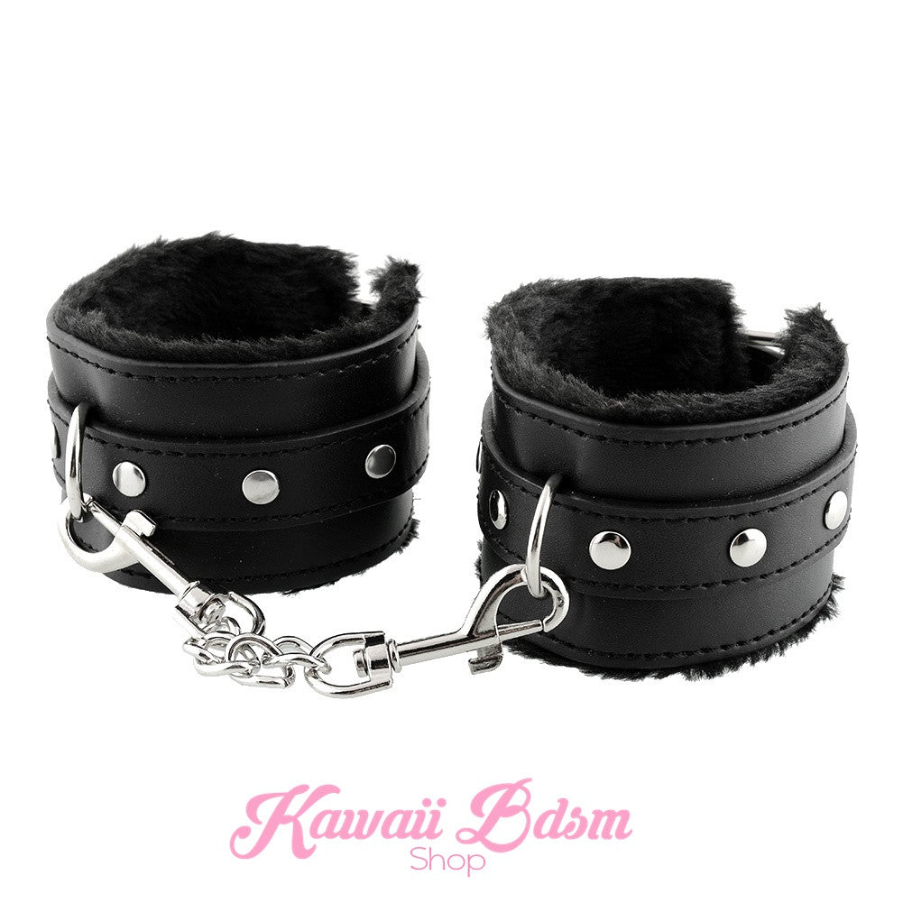 Classic black faux leather cuffs with black faux fur lining, perfect for comfortable and aesthetic restraint play.