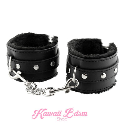 Classic black faux leather cuffs with black faux fur lining, perfect for comfortable and aesthetic restraint play.