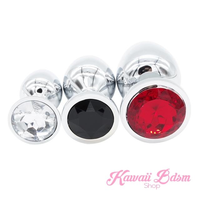 beautifully mixed three-piece metal training plug set featuring clear, black, and ruby red crystal gemstone bases.