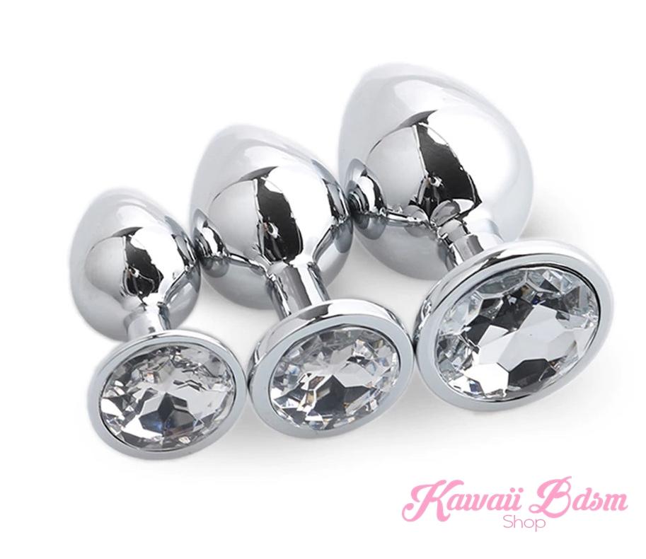 Classic jewel plug training set of three featuring elegant clear diamond-like crystal bases on a pristine white background.